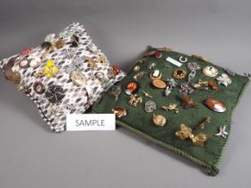 Two cushions mounted with a selection of costume jewellery brooches and other costume jewellery