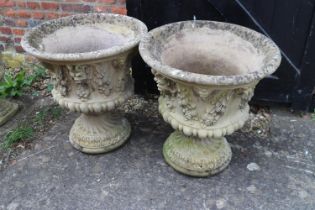 A pair of cast stone campana urns with swag decoration, 20" dia x 22" high