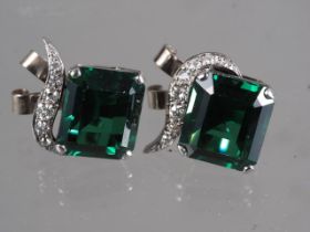 A pair of white metal, tourmaline and diamond earrings