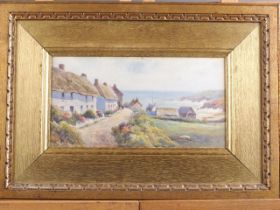 An early 20th century watercolour, Cornish coastline with thatched cottages, 6" x 11", in gilt frame