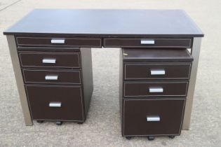 A "leather" desk with brushed steel frame, 47" wide x 24" deep x 29" high, and a pair of matching