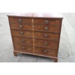 A George III burr yew secretaire chest with fitted writing compartment, secret compartments, drawers