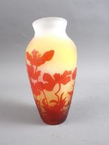 An early 20th century Emile Galle cameo vase with flower and butterfly decoration on a yellow shaded