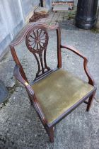 An early 19th century mahogany carver chair of Hepplewhite design with pierced splay and drop-in