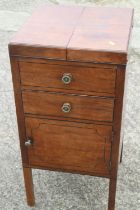 A late 19th century mahogany and ebony strung washstand with hinged top over drawer and cupboard,