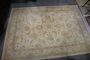 A wool pile rug, of traditional Persian all-over scroll design on a light ground, 79" x 116" approx