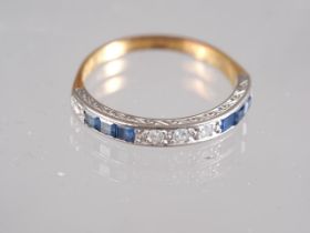 An 18ct and white gold half eternity ring, set diamonds and sapphires, ring size Q, 2.8g gross