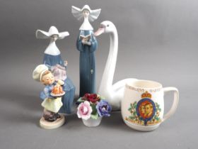 Two Lladro nuns, a Lladro swan, a Hummel figure of a baker, a coronation mug and an Aynsley posy