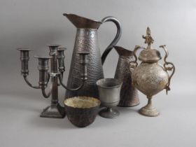 Two crocodile skin embossed copper hot water jugs, a five-light candlestick, a bowl, a goblet and an