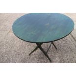 A green painted coaching table, 38" dia