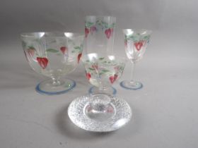 An Orrefors enamel glass vase, 8 1/2" high, two matching bowls, a wine glass and an Orrefors