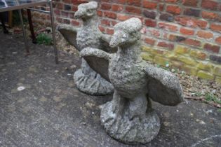 A pair of cast stone eagles, 20" high
