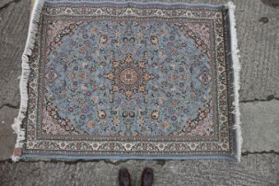 A Turkish Hisar rug with all-over floral design on a blue ground, 78" x 58" approx