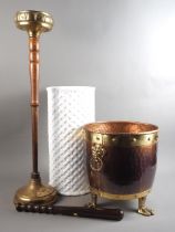 A copper and brass coal bucket with mask handles, on three paw supports, 11" dia, a white glazed,