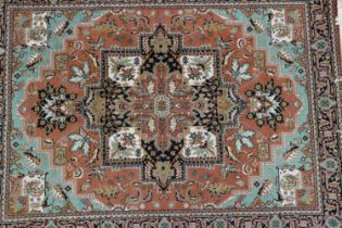 A Turkish Hisar rug with all-over design on a brown ground and multi-bordered in shades of blue,