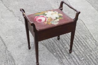 An Edwardian box seat piano stool, on square taper supports