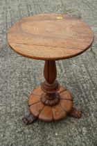 A William IV mahogany circular top occasional table, on turned and carved column, circular base