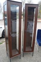 A pair of walnut effect finish display cabinets, 15" square x 70" high