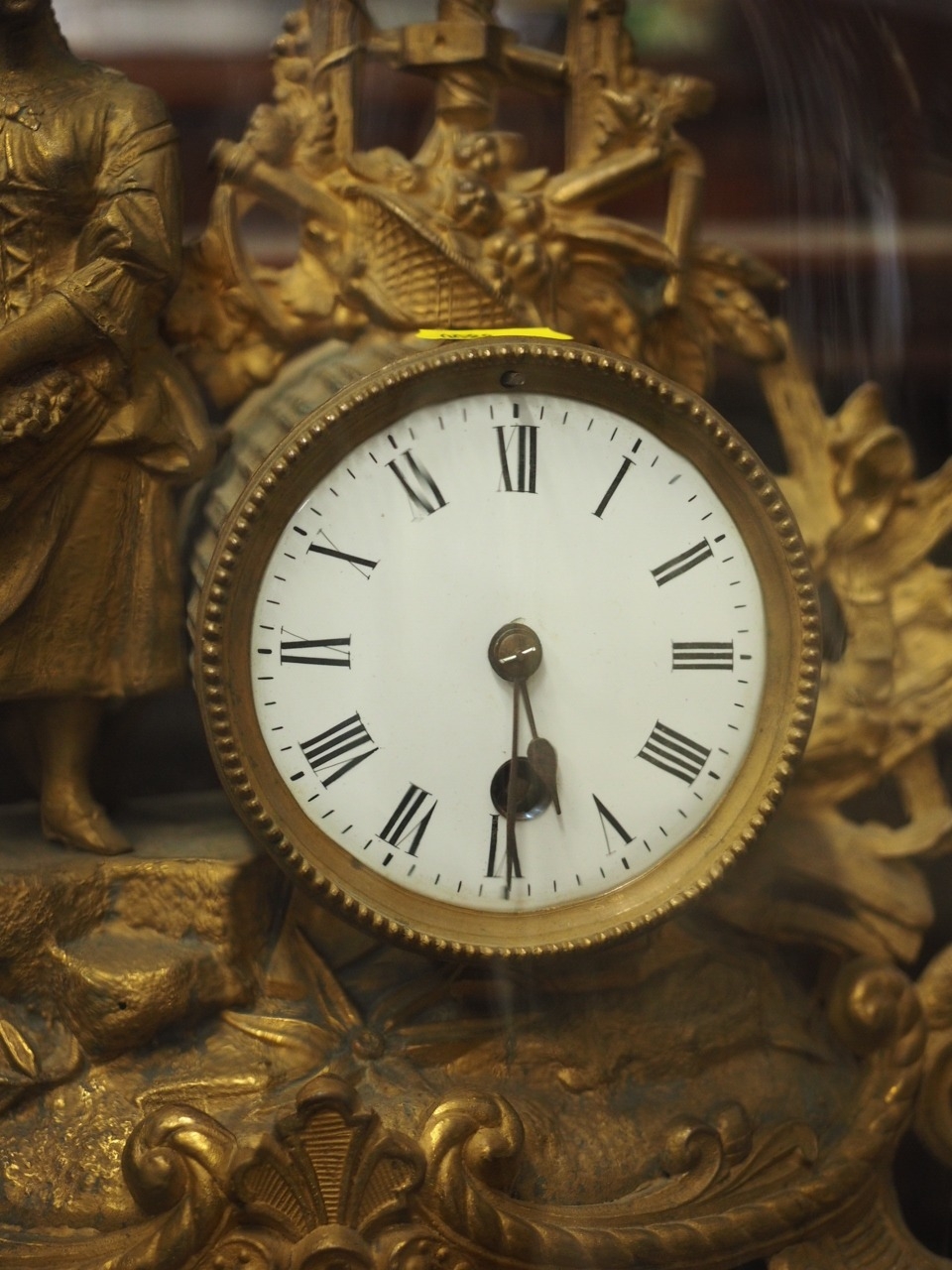 A 19th century French gilt metal mantel clock with white enamelled dial and attendant figure, - Image 2 of 3