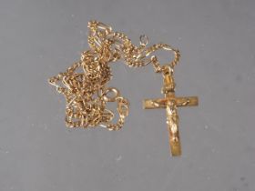 A 9ct gold crucifix pendant, on 9ct gold chain, 4.2g