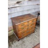 An 18th century oak chest of four long graduated drawers, 32 1/2" wide x 17" deep x 29" high