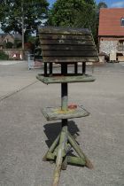 A wooden bird table/nest box, 69" high