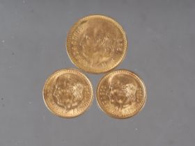 A Mexican 5 pesos gold coin and two Mexican 2 1/2 pesos gold coins, 8.3g gross