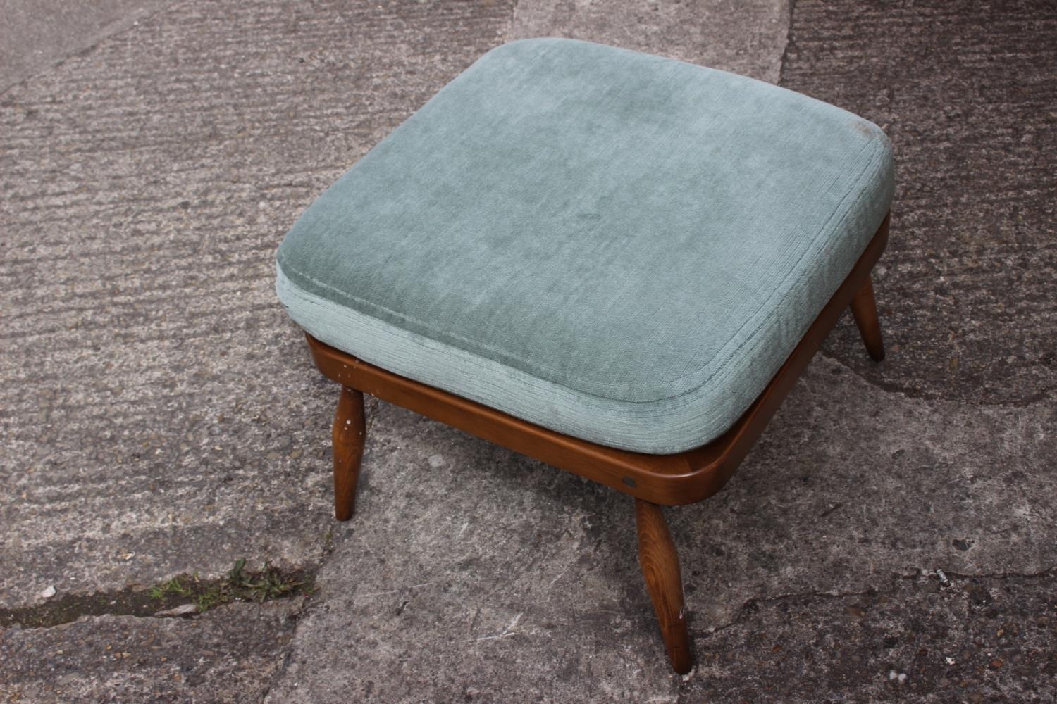An Ercol stool with cushion seat, on turned supports, 20" square x 15" high