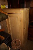 A waxed pine cupboard enclosed two panelled doors, 36" wide x 13" deep x 52 1/2" high