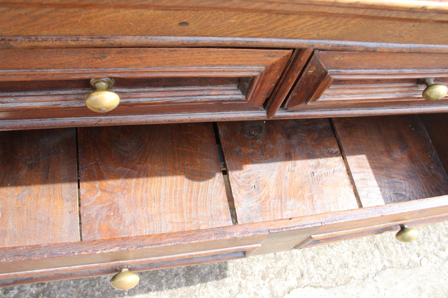An 18th century oak panelled front chest fitted two short and two long drawers with brass knob - Image 3 of 4
