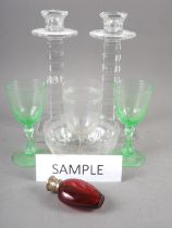 A ruby glass and silver gilt topped scent bottle, 3 1/4" high, four uranium glass goblets, a pair of