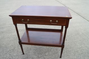 A mahogany and satinwood banded two-tier drinks table, fitted two drawers, on turned supports, 35"