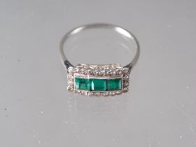 A platinum dress ring, set three square-cut emeralds, flanked diamonds, size P, 2.7g