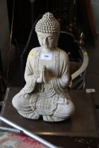 A cast stone figure of Buddha, 14 1/2" high