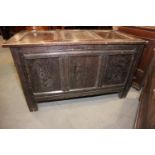 An early 18th century quarter cut oak triple panel front coffer, on moulded stile supports, 45 1/
