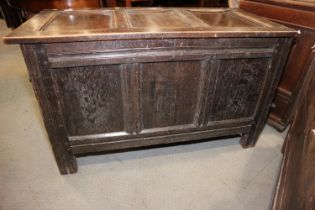 An early 18th century quarter cut oak triple panel front coffer, on moulded stile supports, 45 1/