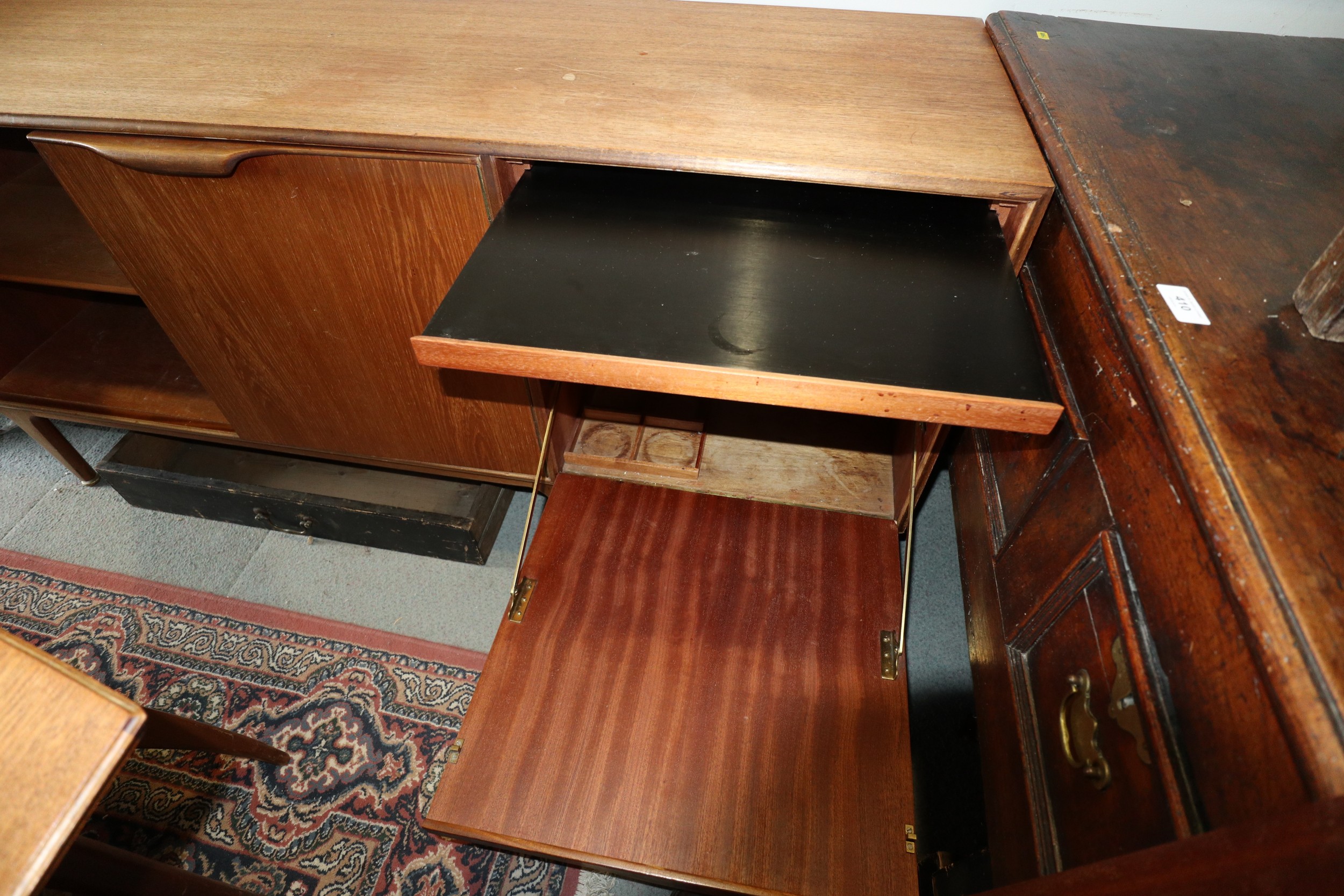 A 1960s McIntosh sideboard, fitted three drawers and three doors enclosed shelves, cellarette and - Image 4 of 6