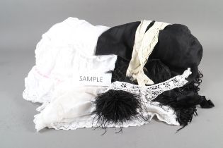 A quantity of antique clothing, including petticoats, bloomers, shawl, embroidered jacket, etc