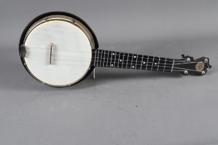 A contemporary Jolli-Joe four-string banjolele with black gilt sparkle finish, 21" long