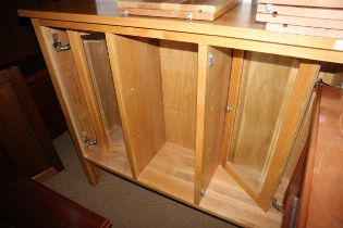 A modern oak open bookcase with two shelves, enclosed two glazed doors, 39 1/2" wide x 15 1/2"