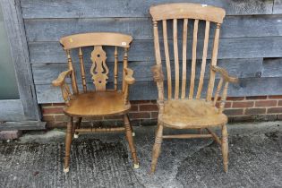 A Windsor farmhouse lath back elbow chair, on turned and stretchered supports and a splat back elbow