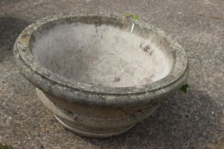 A cast stone circular planter, 24" dia