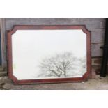 A figured walnut framed wall mirror with shaped plate, 26 1/2" x 38" overall, and a wall mirror with