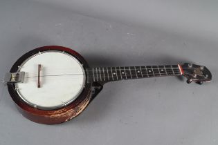 A Vintage Keech four-string banjolele, 25" long with scratched signature to reverse of case, "