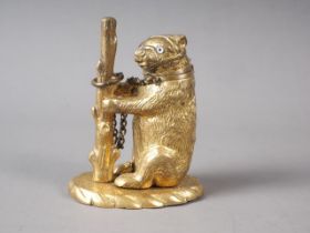 A gilt brass "go to bed" vesta formed as a bear, 3" high