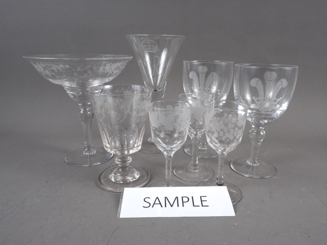A 1953 Coronation ale glass, a 20th century engraved goblet, and other cut glass and engraved