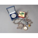 A filigree galleon brooch, two white metal rings, a rolled gold cased pocket watch and other
