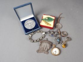 A filigree galleon brooch, two white metal rings, a rolled gold cased pocket watch and other