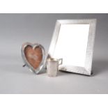 A Goldsmiths and Silversmiths silver photo frame with engine turned decoration, 6 1/2" x 4 3/4", a