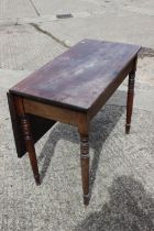 A 19th century mahogany single drop leaf dining table, on turned and tapering supports, 34 1/2" wide